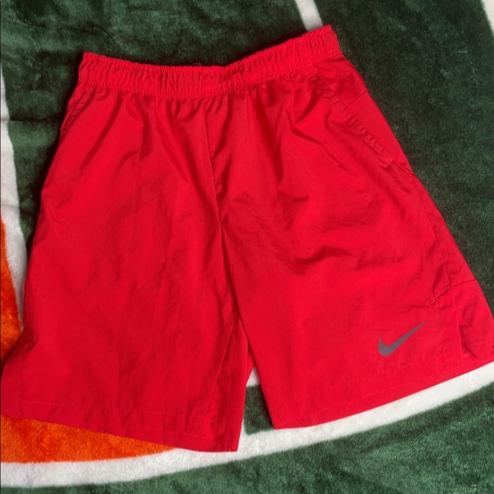 Red Nike shorts